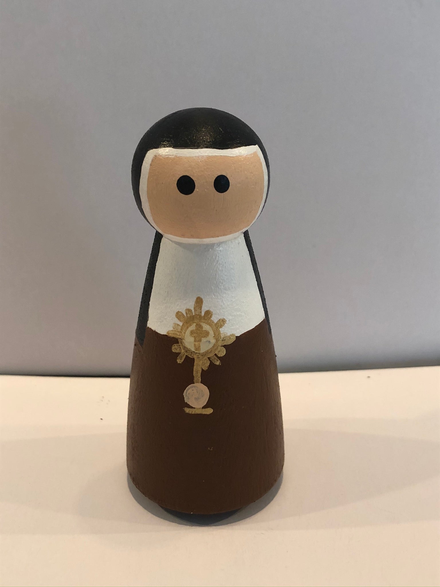 St Clare peg doll